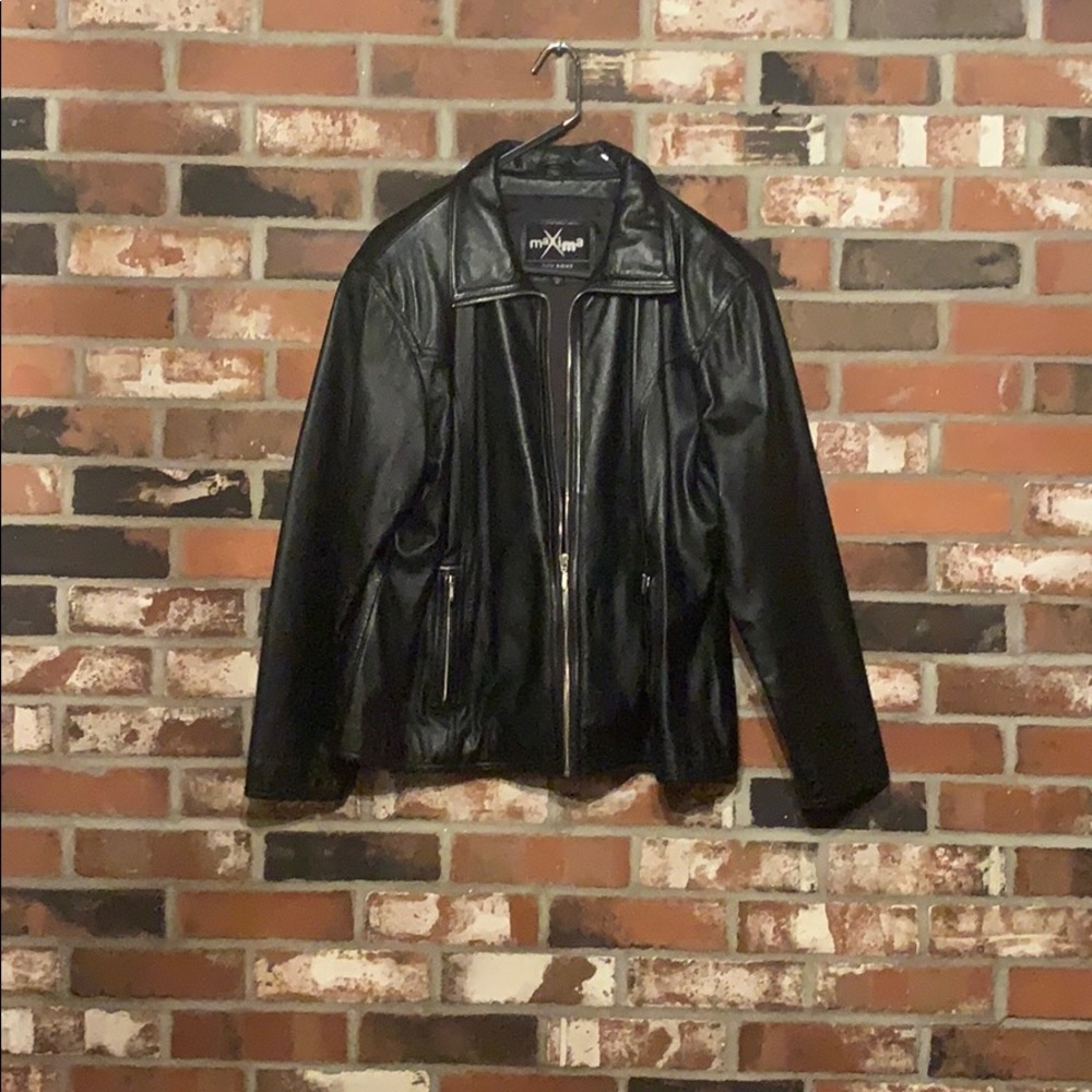 Leather jacket in near perfect condition .